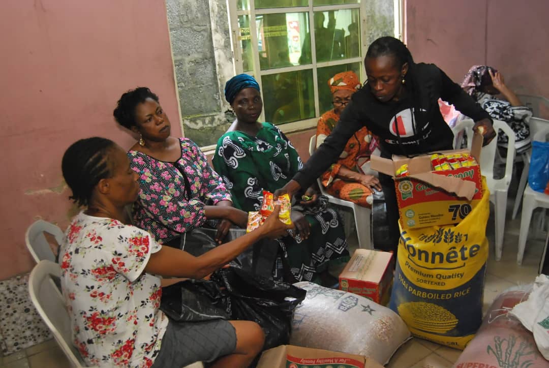 Ministry volunteers preparing food items for distribution