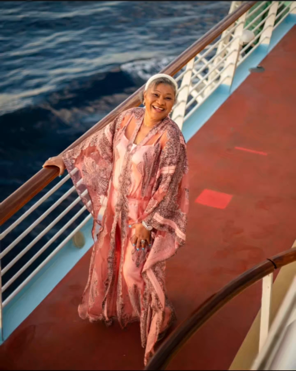June Ajuwa Anison smiling on an outdoor ship deck